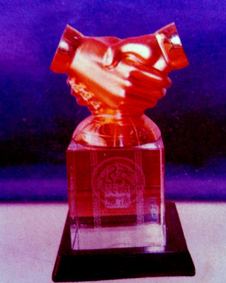 Ghana-shaped crystal award with engraved business details