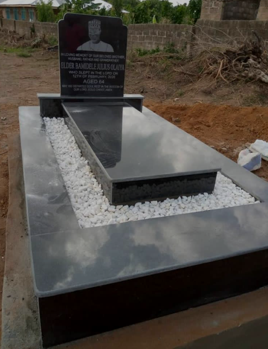 Grave headstone engraved with religious icons and scripture by Chembx in Lagos, Nigeria.